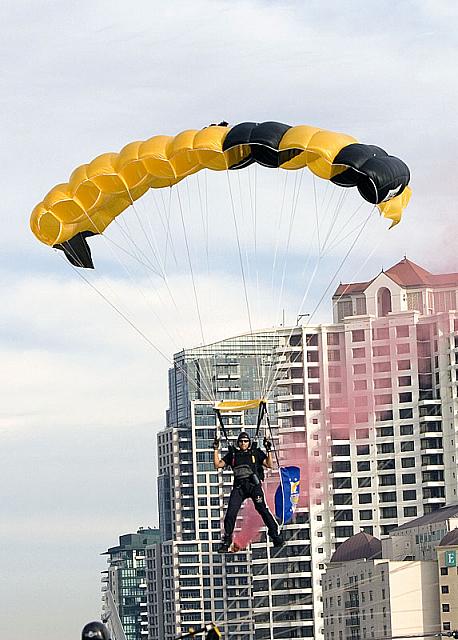 Skydiver descending toward flight deck [11-11-09] - Clint Griffin photo