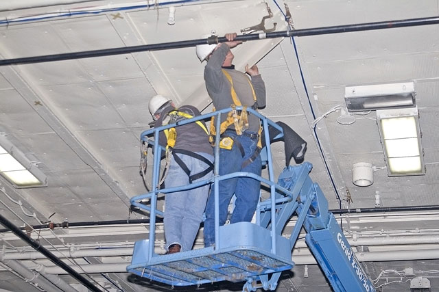 Installing angle brackets to hold Bird Dog airplane [02-22-10] - Clint Griffin Photo