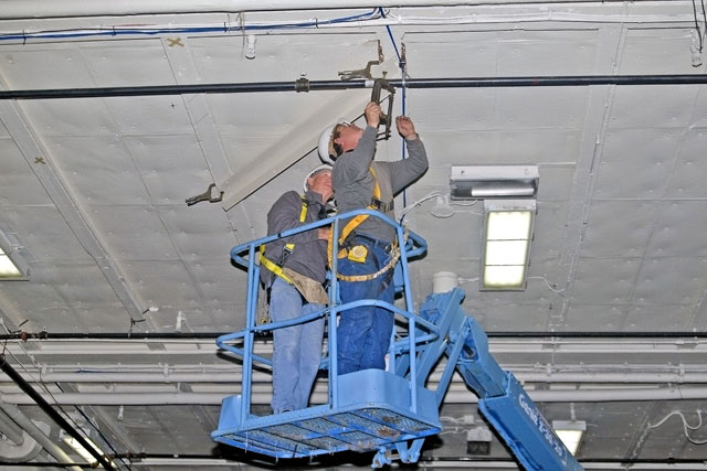Installing angle brackets to hold Bird Dog airplane [02-22-10] - Clint Griffin Photo