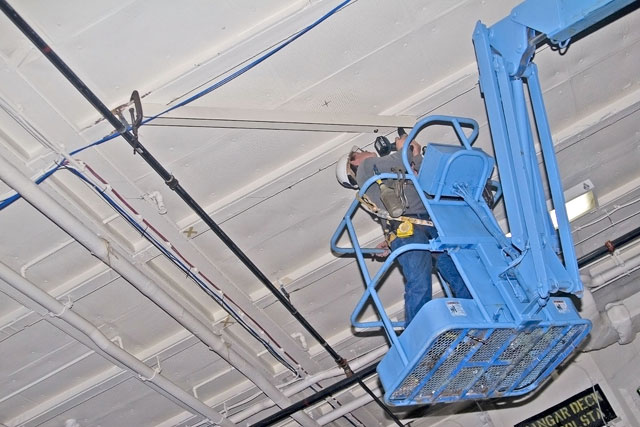 Installing angle brackets to hold Bird Dog airplane [02-22-10] - Clint Griffin Photo