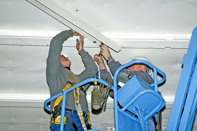 Installing angle brackets to hold Bird Dog airplane [02-22-10] - Clint Griffin Photo