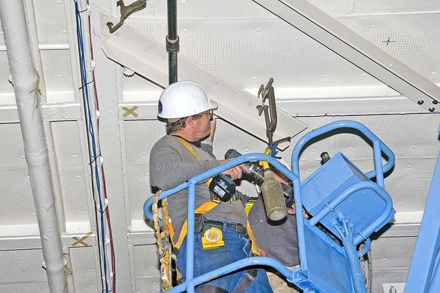 Installing angle brackets to hold Bird Dog airplane [02-22-10] - Clint Griffin Photo
