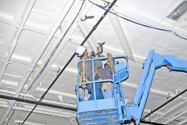 Installing angle brackets to hold Bird Dog airplane [02-22-10] - Clint Griffin Photo