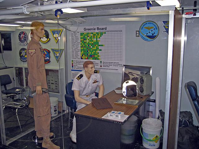 SDO Desk - For some reason this guy is in his whites.  The greenie board is on the wall.