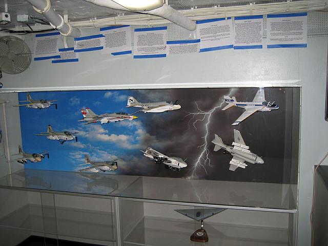 These are photos of a glass display case about eight feet long and three feet high