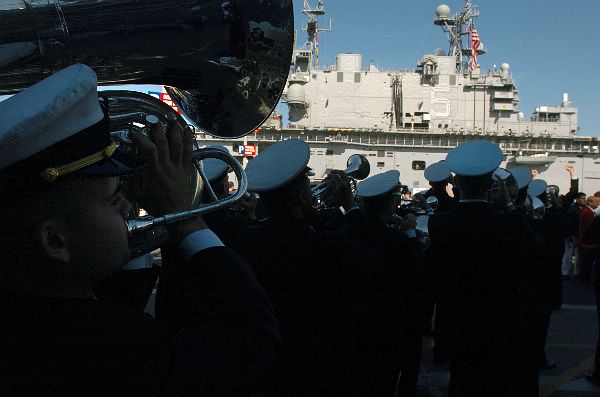 San Diego (Dec. 21, 2005) - U.S. Naval Academy Midshipmen Band perform outside the decommissioned aircraft carrier USS Midway (C