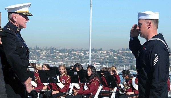 San Diego, Calif. (Nov. 8, 2006) - A Sailor renders a salute before receiving his certificate of citizenship aboard USS Midway a