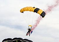 Skydiver descending toward flight deck [11-11-09] - Clint Griffin photo