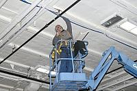 Installing angle brackets to hold Bird Dog airplane [02-22-10] - Clint Griffin Photo