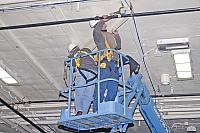 Installing angle brackets to hold Bird Dog airplane [02-22-10] - Clint Griffin Photo