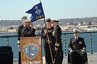 Col. Douglas P. Yurovich of the Marine Corps, assumes command of Carrier Air Wing Nine (CVW-9), during a ceremony aboard USS Mid